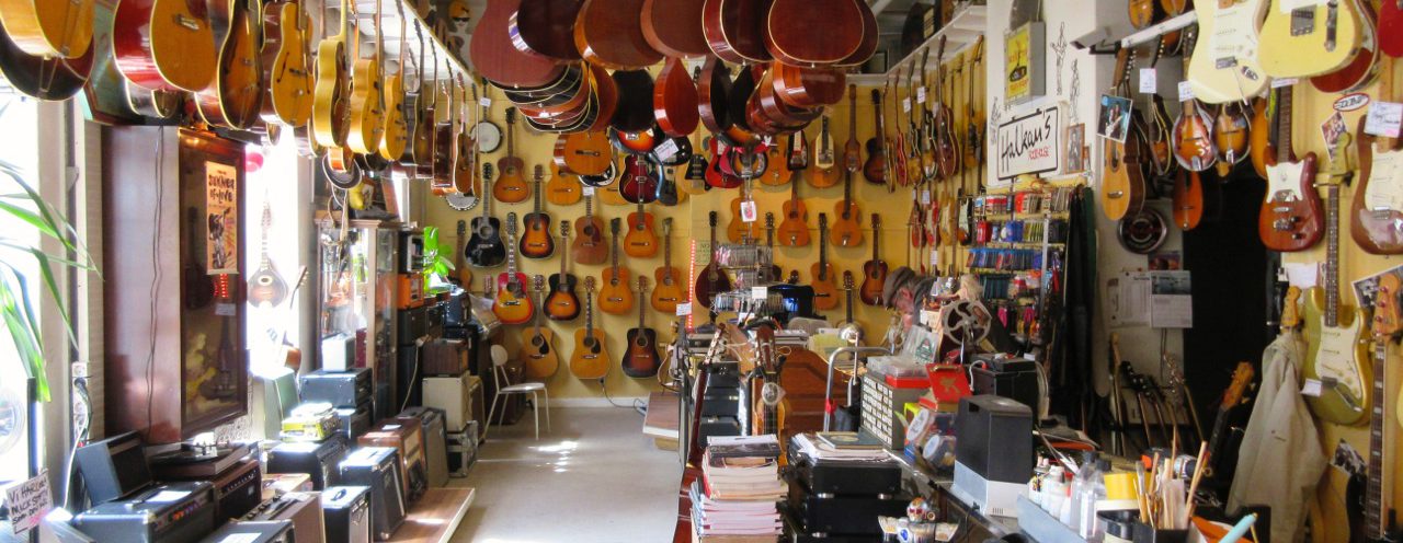 Working on a guitar in the repair shop.